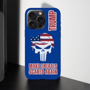 May include: Blue phone case featuring a skull design with an American flag motif and the text "TRUMP". The case also includes the phrase "MAKE LIBERALS SCARED AGAIN" in red and white.