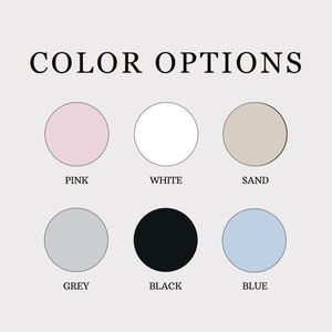 May include: Color options for a product, shown as six colored circles. The colors are pink, white, sand, grey, black, and blue.