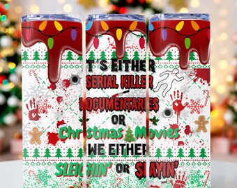 May include: Three stainless steel tumblers with a white background and red and green Christmas-themed design. The tumblers feature the text "It's either serial killer documentaries or Christmas movies. We either sleighin' or slayin'."