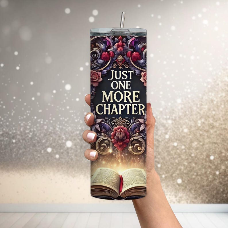 May include: A stainless steel tumbler with a black and gold design featuring an open book with a glowing light and the text "Just One More Chapter".