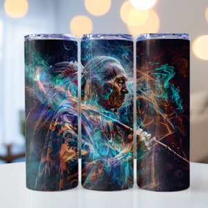 May include: Three stainless steel tumblers featuring a colourful design of a Native American man with a headdress and a pipe. The design incorporates blue, green and orange smoke.