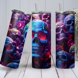 May include: A stainless steel tumbler featuring a colourful skull design. The skulls are blue, purple and pink with neon accents. The tumbler is ideal for holding hot or cold drinks.
