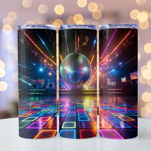 May include: Three stainless steel tumblers featuring a disco ball and dance floor design. The tumblers have a black background with colourful lights and a disco ball hanging from the ceiling. The dance floor is a grid of colourful squares.