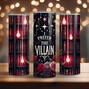 May include: A stainless steel tumbler with a black background and a design featuring a bookshelf with glowing lightbulbs, roses, and the text "I prefer the villain".