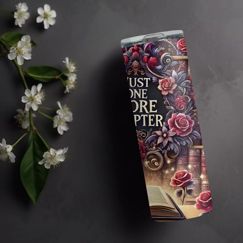 May include: A stainless steel tumbler with a colorful design featuring a book, roses, and the text "Just One More Chapter".