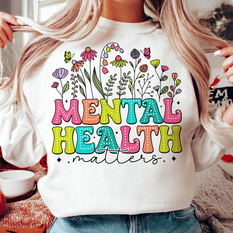 May include: White sweatshirt with a colorful floral design and the text "Mental Health matters".