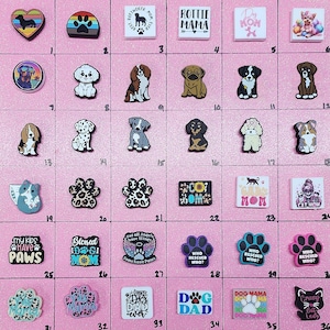 May include: A grid of 36 colorful shoe charms featuring various dog breeds, paw prints, and dog-themed sayings. The charms are arranged in a grid on a pink background.