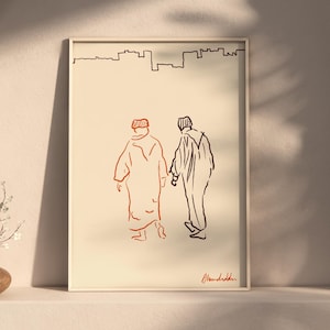 Puede incluir: Una impresión artística enmarcada con un dibujo lineal minimalista de dos figuras caminando, una en rojo y otra en negro, con una silueta de paisaje urbano arriba. La obra de arte se exhibe en una estantería blanca.