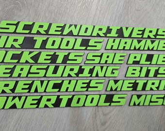 May include: Green and black labels with the words "Screwdrivers", "Air Tools", "Hammers", "Sockets", "SAE Pliers", "Measuring Bits", "Wrenches", "Metric", "Power Tools", and "Misc."