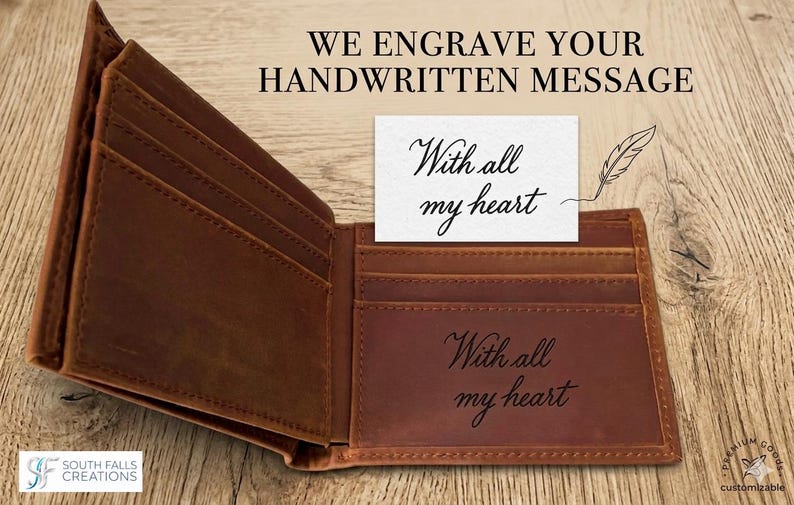 May include: Open brown leather wallet with multiple card slots. The text "WE ENGRAVE YOUR HANDWRITTEN MESSAGE" is at the top. A card with "With all my heart" is placed inside the wallet, and the same phrase is engraved on the wallet.