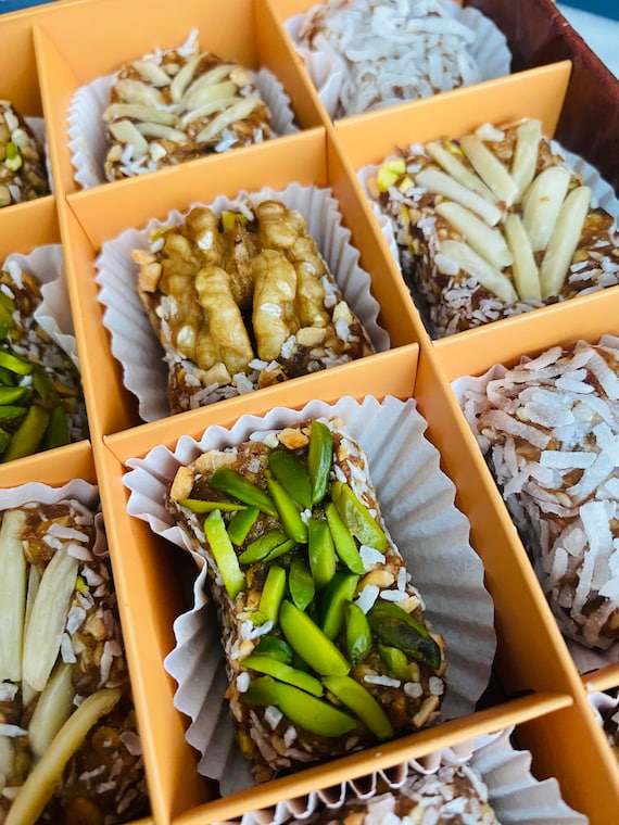 Medjool date paste bites, blended and topped with fresh nuts, vegetarian, gluten free, high fiber, energy food, best gift for loved ones !
