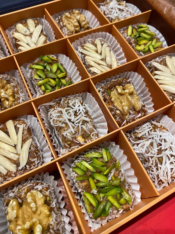 Medjool date paste bites, blended and topped with fresh nuts, vegetarian, gluten free, high fiber, energy food, best gift for loved ones !