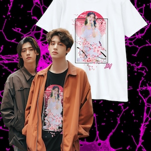 May include: Two people wearing t-shirts with a graphic print of a woman in a white dress with pink flowers. The woman is holding a microphone and singing. The text "IM" is printed on the shirt.