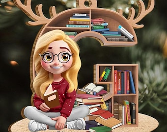 May include: A wooden Christmas ornament featuring a cartoon girl with blonde hair, glasses, and a red sweater, holding a book. The ornament has a bookshelf design with books and the name "Gloria".