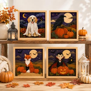 May include: Four square framed wall art pieces featuring Halloween themes. One shows a dog in a ghost costume, one a black raven on pumpkins, one a fox in a night landscape, and one a vampire with a jack-o'-lantern, all with quilted textures.