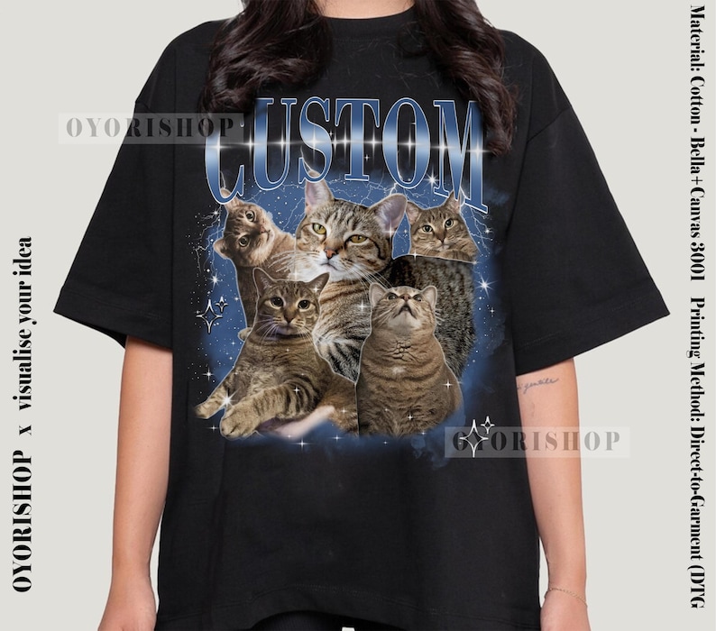 May include: Black t-shirt with a graphic print of five cats in a galaxy-like background. The text "CUSTOM" is printed in white on the shirt.