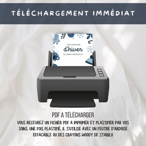 May include: A black and white illustration of a printer with a white sheet of paper in the tray. The paper has a blue and white winter-themed design with the text "MON GRAPHISME d'hiver CE CARNET APPARTIENT A". The text below the printer reads "PDF A T&Eacute;L&Eacute;CHARGER VOUS RECEVREZ UN FICHIER PDF A IMPRIMER ET PLASTIFIER PAR VOS SOINS. UNE FOIS PLASTIFI&Eacute;, IL S'UTILISE AVEC UN FEUTRE D'ARDOISE EFFACABLE OU DES CRAYONS WOODY DE STABILO".