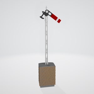 May include: A red and white railway signal arm in the down position, indicating stop. The signal arm is mounted on a white metal pole with a black base. The pole is attached to a brick base.