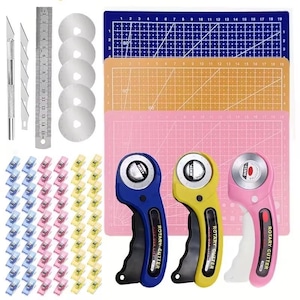 May include: A craft tool set including three 45mm rotary cutters in blue, yellow, and pink, five replacement blades, a metal craft knife with extra blades, a 15-inch metal ruler, three cutting mats in blue, orange, and pink, and assorted clips.