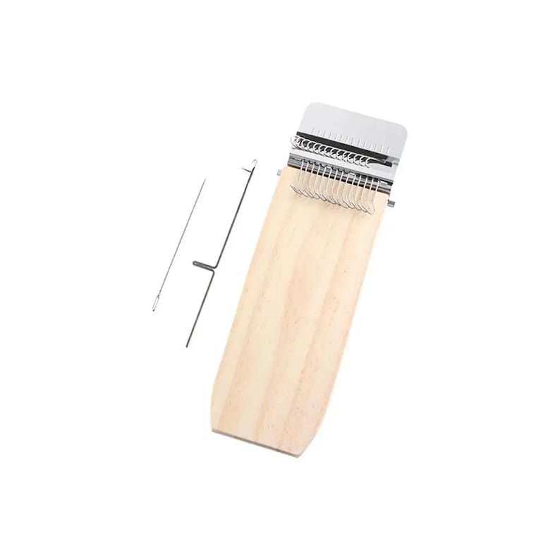 May include: A wooden weaving loom with a metal comb and a metal needle. The loom is made of light-colored wood and has a rectangular shape with a curved bottom. The metal comb is at the top of the loom.