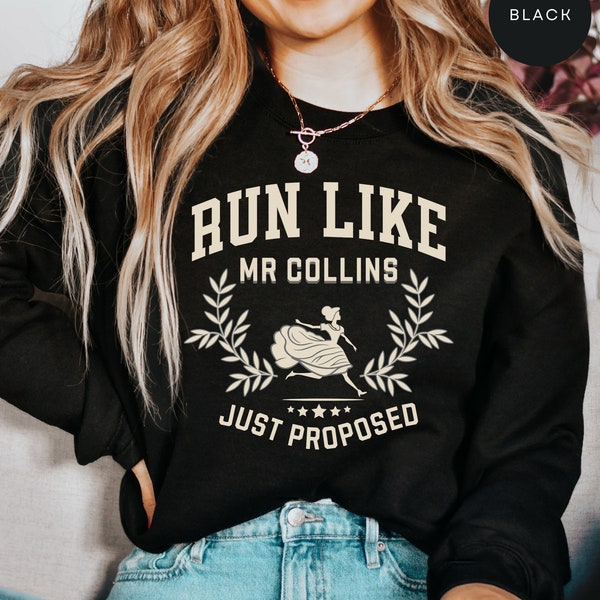 Puede incluir: Sudadera negra con el texto "Run Like Mr. Collins Just Proposed" en blanco con un gráfico de Cenicienta corriendo.
