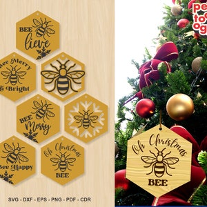 Può includere: Sei ornamenti natalizi esagonali a tema ape. Gli ornamenti sono gialli con illustrazioni di api nere e testo che dice "Bee Merry & Bright", "Bee Happy", "Bee Merry", "Oh Christmas Bee", "Oh Christmas Bee" e "Bee Lieve".