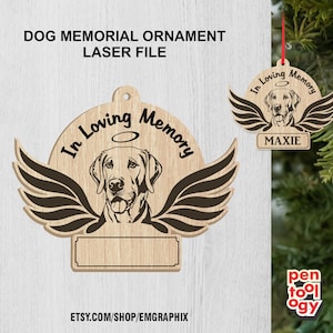 Puede incluir: Adorno de madera cortado con láser con una silueta de perro, alas y halo. El adorno dice "In Loving Memory" y tiene un espacio en blanco para un nombre.