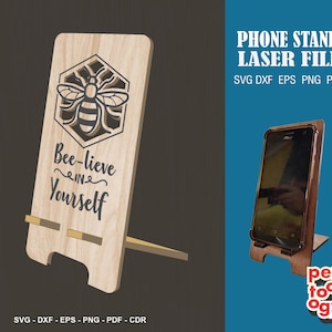 May include: A wooden phone stand with a bee and honeycomb design. The stand has the text "Bee-lieve in Yourself" and is designed for laser cutting.