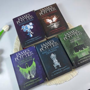 May include: A collection of five hardcover books titled "James Potter" with various subtitles. The book covers feature illustrations in shades of blue, green, and brown, with titles like "Morrigan Web" and "Crimson Thread".