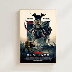 Puede incluir: Un póster enmarcado de la película "Predator: Badlands" presenta una figura central sosteniendo un arma, con el texto "FIRST HUNT. LAST CHANCE." El póster tiene un esquema de color oscuro con un diseño futurista y orientado a la acción. También es visible el texto "IN THEATERS NOVEMBER 7".