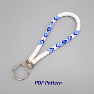 May include: White beaded key chain with blue and light blue diamond patterns and a silver key ring.  PDF Pattern.