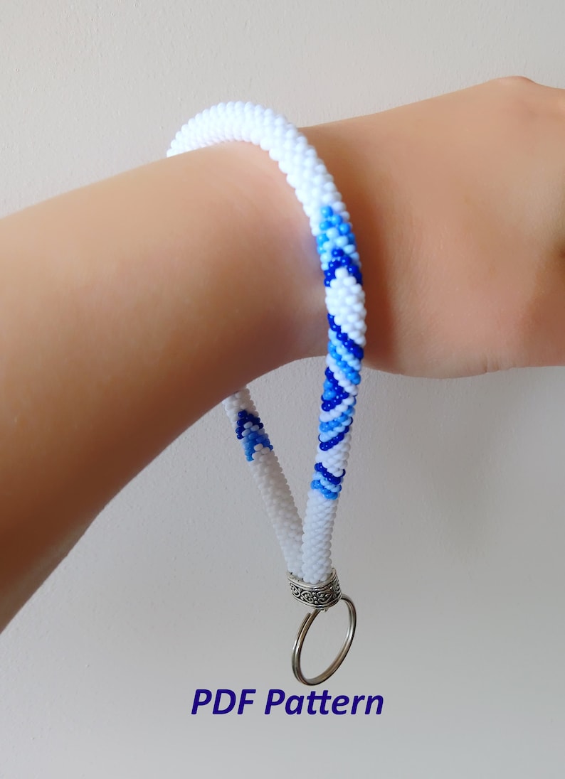 May include: White and blue beaded lanyard with a silver key ring.  PDF Pattern.