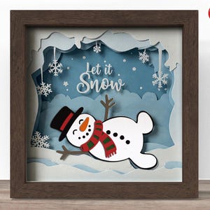 3d snowman lying shadow box SVG, Cricut SVG File, Christmas shadow box file, 3d papercut let it snow SVG cut file, CrafterLobby