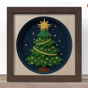 May include: A framed paper art piece featuring a layered Christmas tree design. The green tree is adorned with red ornaments and yellow stars, set against a dark blue starry background. A large gold star tops the tree, and the artwork is encased in a brown wooden frame.