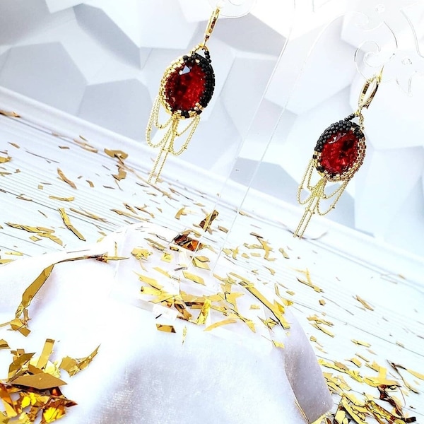 Cheeky girl... Earrings with Austrian Scarlet color stones in gold and black beads with golden chains.