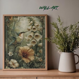 May include: Framed wall art featuring a hummingbird and flowers in a vintage style. The artwork has a wooden frame and depicts a hummingbird with a long beak near white and yellow flowers. The words "WALL ART" are in green at the top.