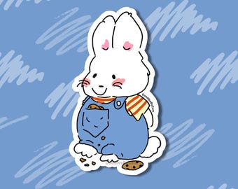 May include: A white cartoon rabbit sticker wearing blue overalls and a striped scarf. The rabbit has pink accents on its ears and cheeks, and a cookie is in its pocket. The sticker is on a blue background with white scribbled lines. Text on the sticker reads "DoodlesByCam".