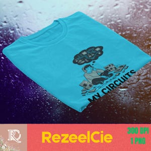 May include: A bright cyan t-shirt featuring a graphic illustration of a person wearing headphones, sitting cross-legged while surrounded by various electronic components and a thought bubble containing circuit patterns, with the text MY CIRCUITS.