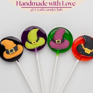 Handmade Halloween lollipops with witch hat sugar figures