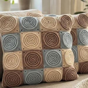 May include: A set of three ceramic mugs with a speckled, matte finish. The mugs are in shades of cream, light gray, and dark gray. Each mug has a simple, minimalist design, perfect for coffee or tea.