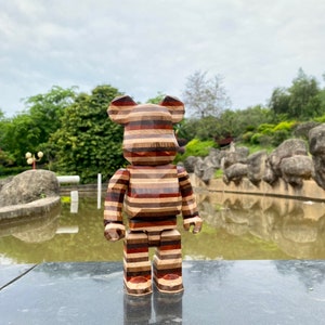BE@RBRICK 400% Polygonal Karimoku Sculpture carved in horizontal layers of aged beech, ebony, maple, rosewood and walnut