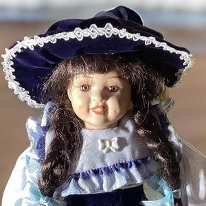 Doll with Case and Clothes