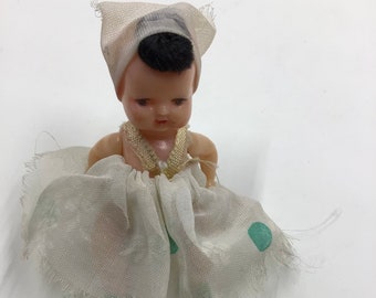 Tiny baby doll from Italy