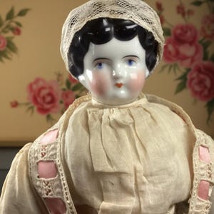 Antique 20-Inch China Head Doll – Late 1800s – Victorian Era – Cloth Body – White Lace Dress with Pink Ribbon – Exceptional Coloring