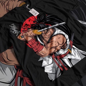May include: Black t-shirt with a graphic of a samurai warrior holding a sword in front of a red circle with black splatters. The text "Samurai" is written in Japanese characters on the left side of the design.