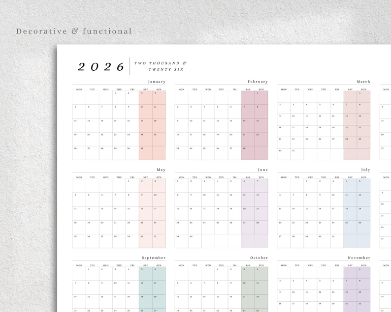 May include: A white 2026 calendar with monthly layouts. Each month has a different pastel color highlight. The text "Decorative & functional" is at the top left. The year "2026" is displayed prominently.