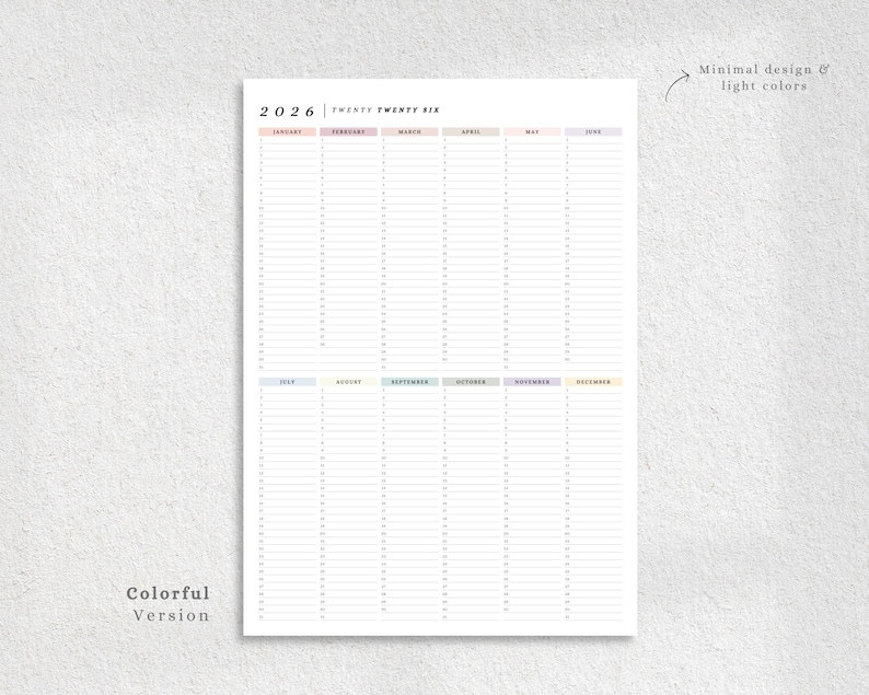 May include: A 2026 yearly planner with a minimalist design and light colors. The planner features a colorful version with monthly columns and space for daily entries. Text on the planner includes the year and month names.