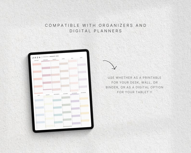 May include: A digital planner displayed on a tablet, featuring a yearly calendar layout with pastel color blocks. The text reads "Compatible with organizers and digital planners." The image also includes the text "Use whether as a printable for your desk, wall, or binder, or as a digital option for your tablet !!"