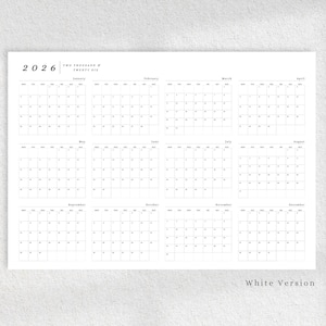 May include: A minimalist white 2026 yearly calendar with a grid layout. The calendar displays all twelve months, with each month's days arranged in a grid. The year 2026 is displayed at the top left, with the text "TWO THOUSAND & TWENTY SIX" next to it.