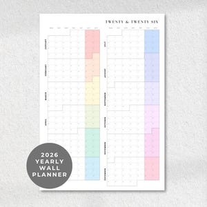 May include: A 2026 yearly wall planner with a minimalist design. The calendar features a white background with a grid layout for each month. Vertical columns are color-coded in pastel shades. The text "Twenty & Twenty Six" is at the top.
